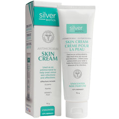 a tube of silver skin cream next to a box